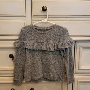 Very cute gray sweater with ruffle. Never worn!